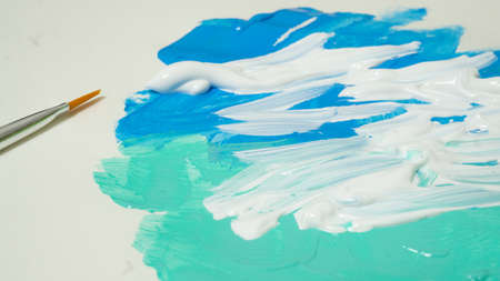 Paints, paper and palettes with beautiful colorsの写真素材
