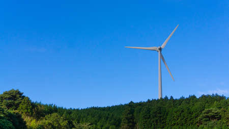 Summer blue sky and wind turbines for wind power generation