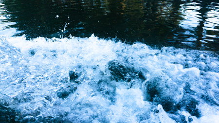 Splashing water from a cruise shipの写真素材