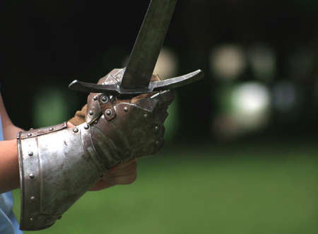 Armed knight with metal glove and heavy sword on medieval festival, Croatiaの写真素材