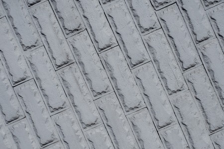 grey brick matt wall background in diagonalの写真素材