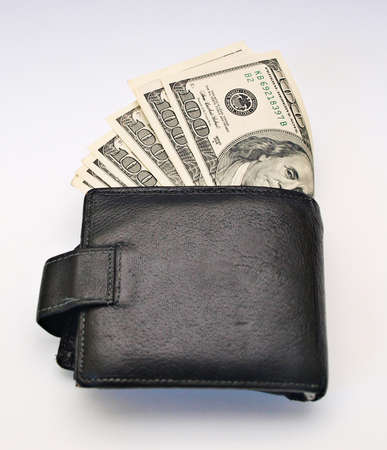 A black man's wallet with US dollars inside    
