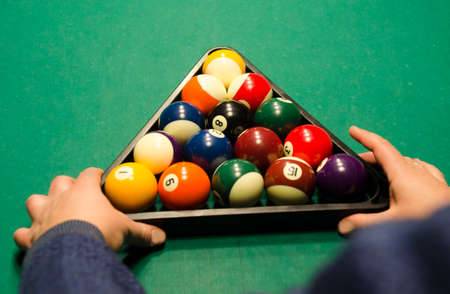 Billiard player is getting ready for a game