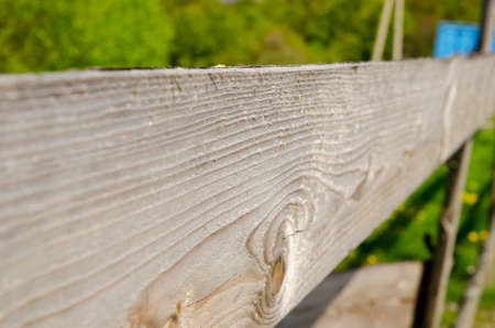 Wooden fence background. Bright wooden border with focus on detailsの写真素材