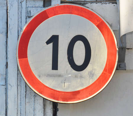 Old traffic sign restricting speed to 10 kilometers per hour