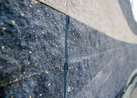 Brick wall turning right, close macro view. Turn right - conceptual photo background
