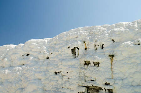 Beautiful white walls of Pamukkale, Turkey, under deep blue summer skyのeditorial素材