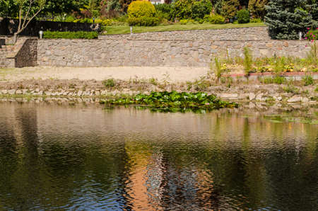 Calm river bay, sea bay photo with trees and housesの写真素材