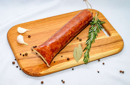 Tasty sausages and vegetables isolated over solid background, food photography