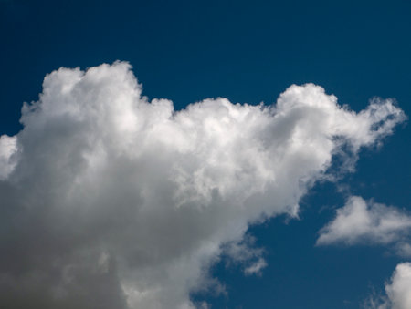White clouds over blue sky background. Fluffy cumulus cloudscape shapeの写真素材