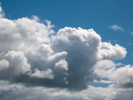 White clouds over blue summer sky background. Fluffy cumulus clouds shapeの写真素材