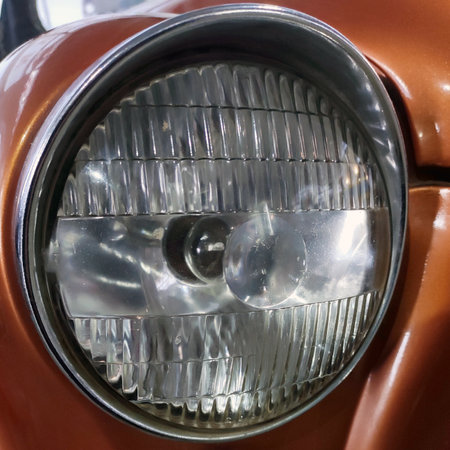 Old retro car headlight close view photo, automobile background