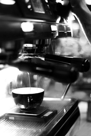 Coffee cup close vew black and white photo background, cup of tea or coffee on the tableの写真素材