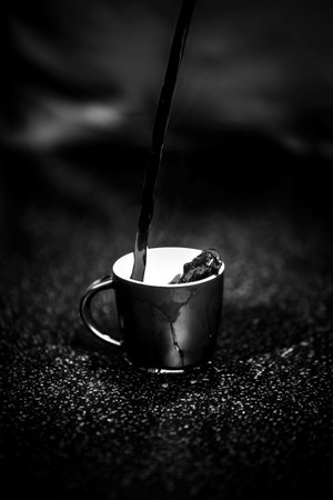 Coffee cup close vew black and white photo background, cup of tea or coffee on the tableの写真素材