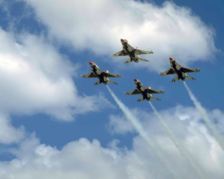 Airshow of military jet fighters. Group of military airplanes performs maneuvers with a smoke trace. Aviation backgroundの写真素材