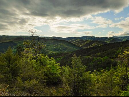 Valley illuminated by the first rays of the sun, rural mountain area, landscapeの写真素材
