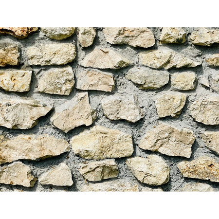 Background of stone wall texture with white space for text or image.の写真素材