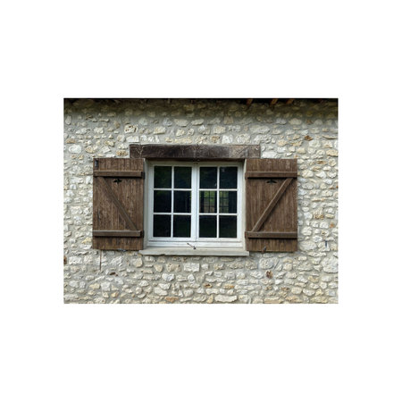 Wooden window on a stone wall isolated on a white background.の写真素材
