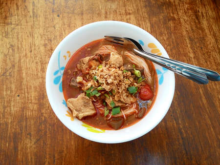 Traditional Northern Thailand Food White Noodles Spicy Soup in a Bowl, Khao Soi Nam Ngeaw, Chiangmai, Chiagraiの写真素材