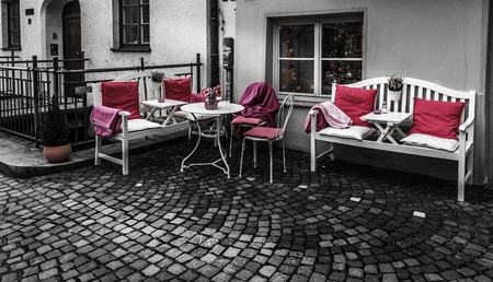 Augsburg, Germany, January 31, 2018. Pink pillows and blankets on the white furniture. Street in old part of town Augsburgのeditorial素材