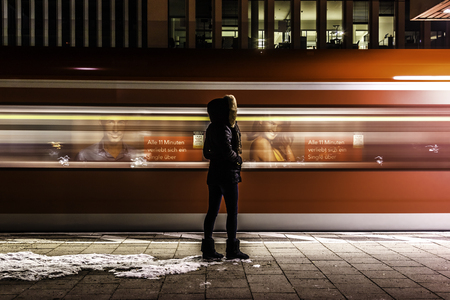 Munich, Germany, Februar 24, 2018. A girl waiting on the Metro station.のeditorial素材