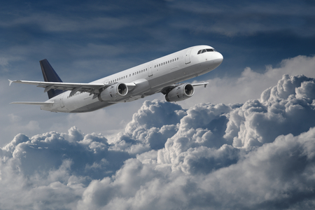 Plane flying above the cloudsの写真素材