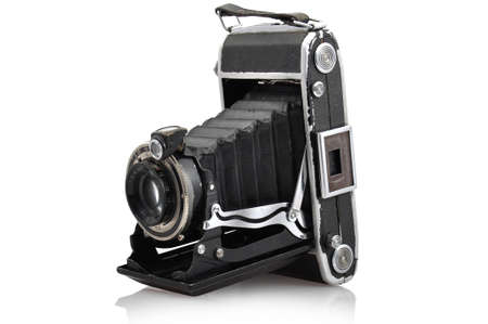Old retro camera separated on white screen