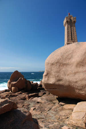 Rocky cliff and stone towerの写真素材