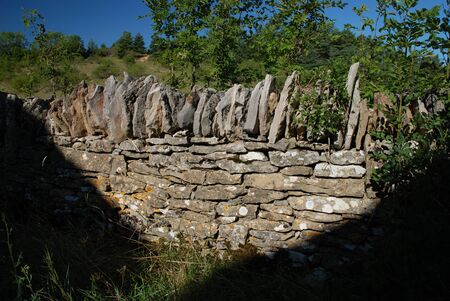 Light and shadow on ancient stone wallの写真素材