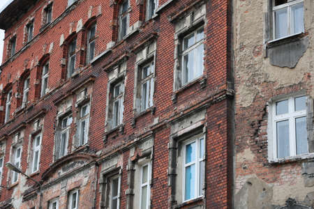 Old and dilapidated brick WrocÅaw tenement houses in the city center.の写真素材