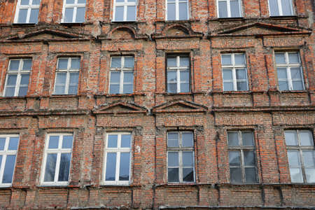 Old and dilapidated brick WrocÅaw tenement houses in the city center.の写真素材