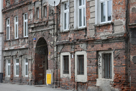 Old and dilapidated brick WrocÅaw tenement houses in the city center.の写真素材