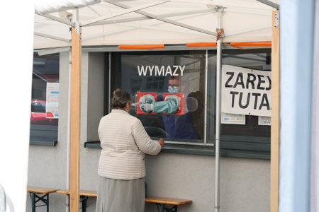 A mobile research point for covid-19 in the red cross tent in WrocÅaw.のeditorial素材