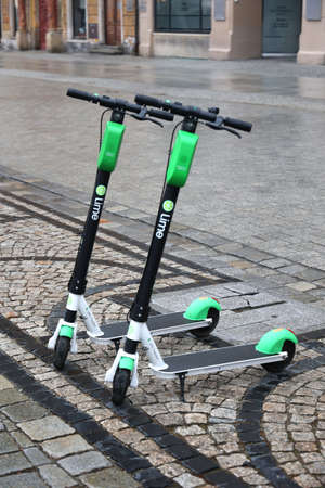 03.29.2021 Wroclaw, poland, Electric scooter parked on the grower in the town.のeditorial素材