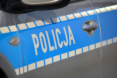 04.01.2021 WrocÅaw, poland, Police blue inscription on a police car of the Polish policeのeditorial素材
