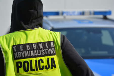 04.30.2021 wroclaw, poland, A forensics technician of the Polish police in a vest.のeditorial素材