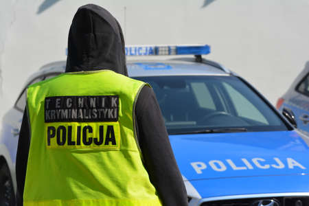 04.30.2021 wroclaw, poland, A forensics technician of the Polish police in a vest.のeditorial素材
