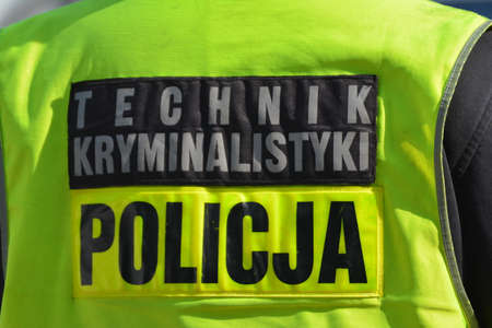 04.30.2021 wroclaw, poland, A forensics technician of the Polish police in a vest.のeditorial素材