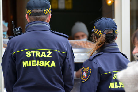 05.03.2021, wroclaw, poland, City guard on a patrol in the old town during a pandemic. City guard...