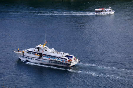 The sea ferry carries tourists to the other side.のeditorial素材