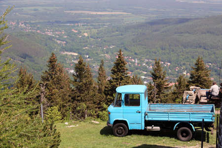View with an old blue truck in the mountains.の写真素材