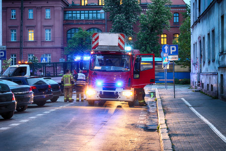 Fire fighting vehicles on the street at night in Helsinki, Finland.のeditorial素材