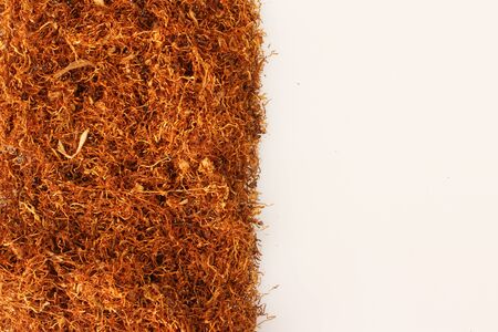Pile of tobacco on white,with place for simple textの写真素材