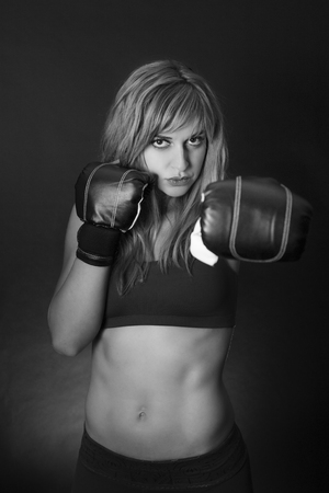 Fitness girl with boxing glovesの写真素材