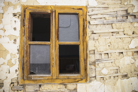 Window on very old village houseの写真素材