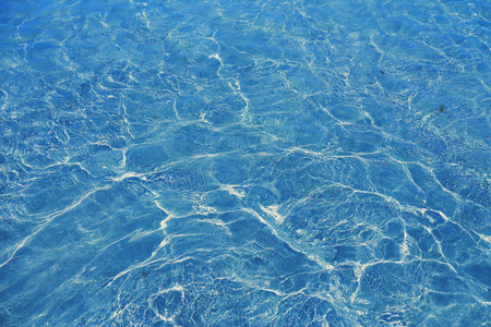 Turquoise blue rippling water surface