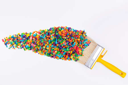Creative layout made of colorful sawdust with paint brush