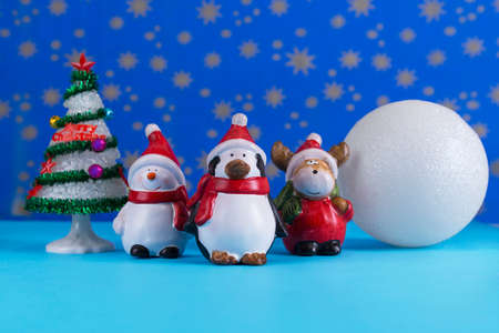 Christmas layout with decorative figurines,moose,snowman and penguinの写真素材