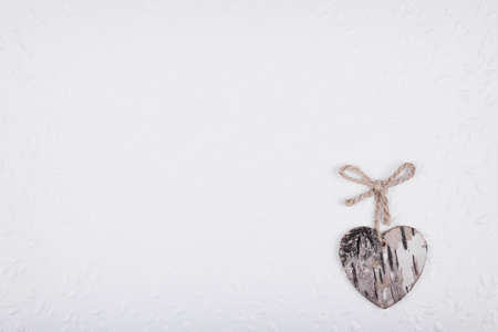 Grunge heart with rope bow on white textured backgroundの写真素材