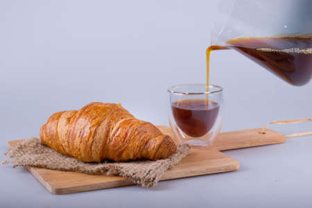 Fresh baked croissant with coffee ,  tasty breakfastの写真素材
